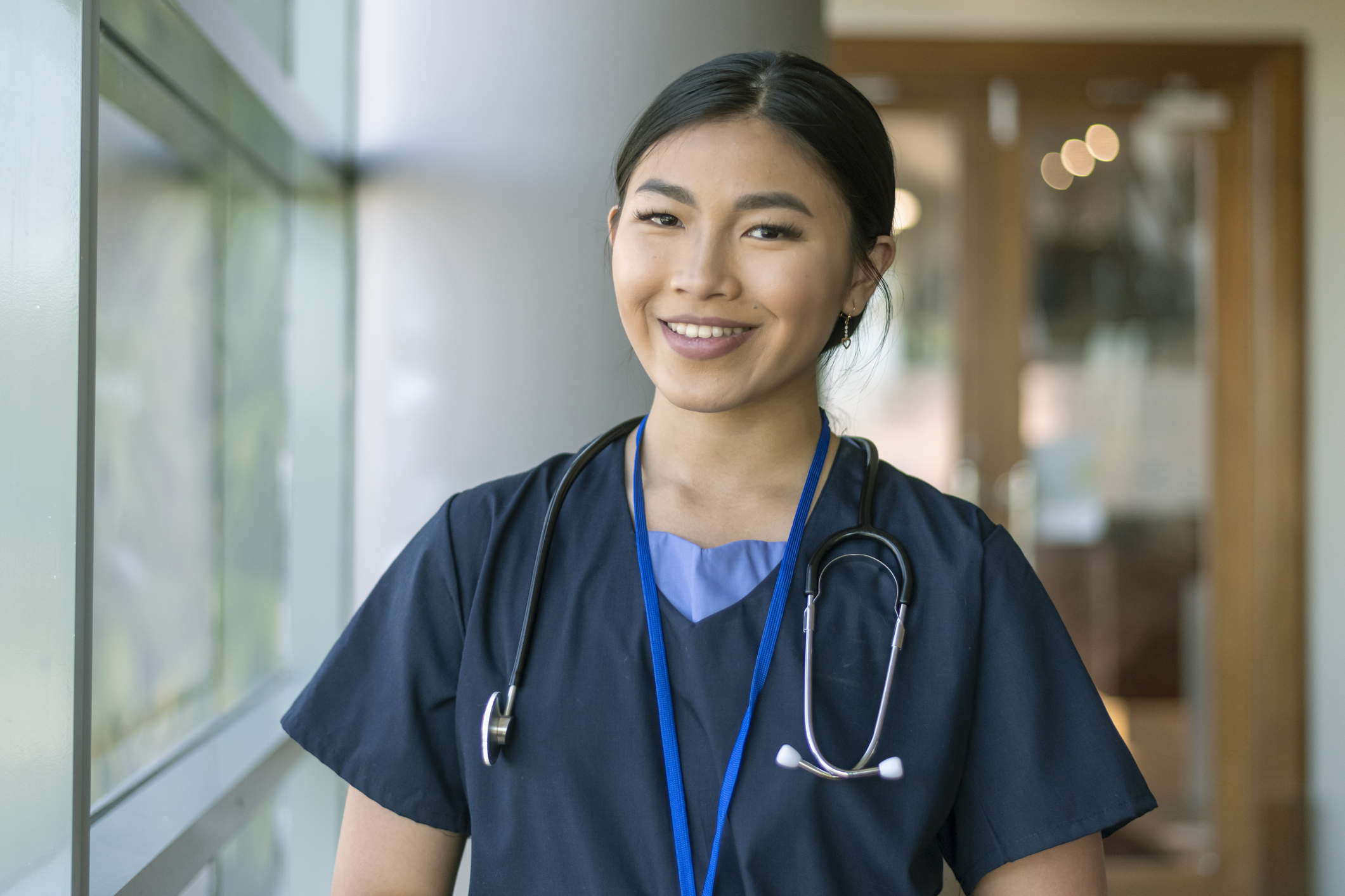 A Young Doctor Poses With A Stethoscope In Uniform Outdoor Shes Holding  Clipboard In Her Hands Stock Photo - Download Image Now - iStock