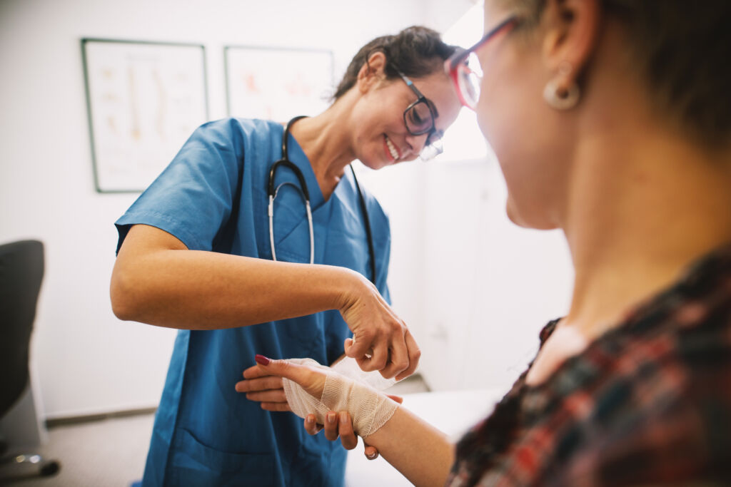 vocational nurse dressing a patient's wound