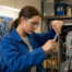 hvac student in workshop at school fixing HVAC unit