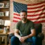 veteran sitting in living room with american flag in background